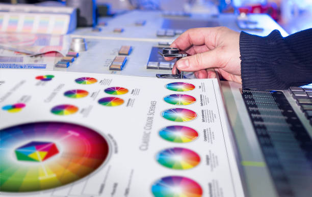 istock Man in the process of offset printing and color correction 1017328678