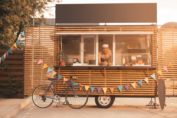 istock handsome chef looking at camera from food truck 1017338230