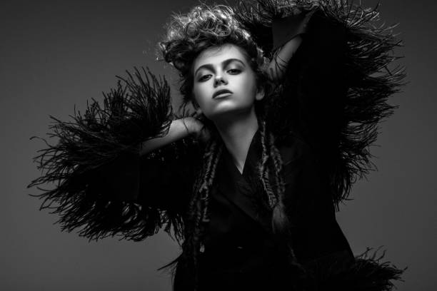 istock Beautiful woman on dark background 1017359586