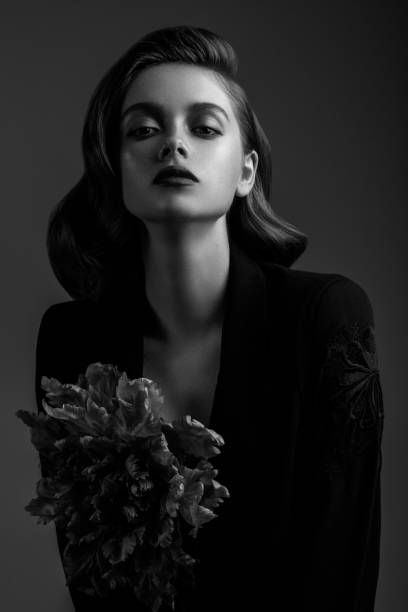 istock Beautiful woman on dark background 1017359606