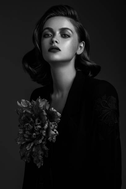 istock Beautiful woman on dark background 1017359618