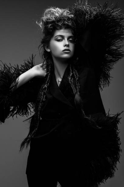 istock Beautiful woman on dark background 1017359696