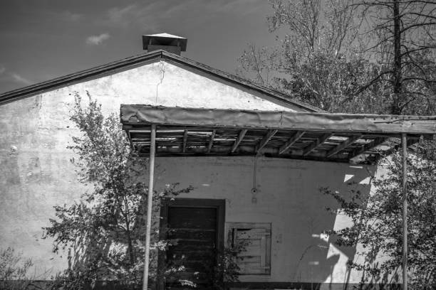 istock abandoned home on side of road monochrome 1017374776