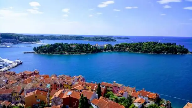 Two little islands next to Rovinj with the sea and the beautiful little houses of Rovinj. Taken from the old church of the town.