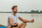 Fit man exercising yoga