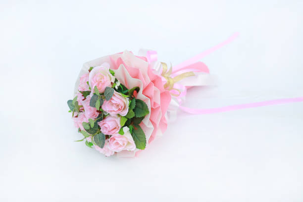 istock Artificial pink roses bouquet isolated on white background. 1017405836