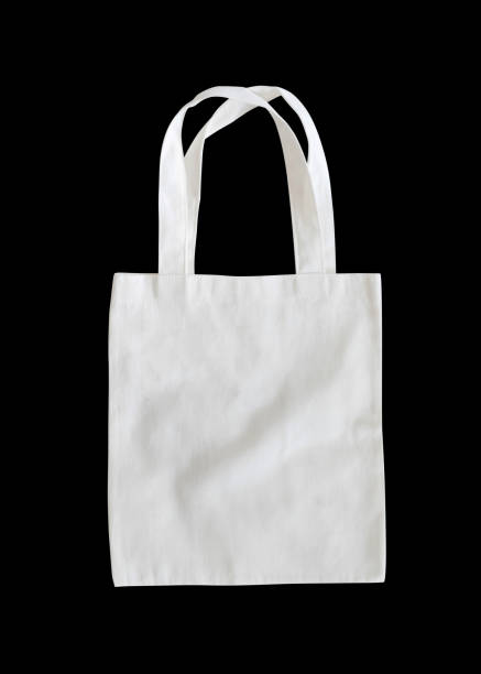 istock Tote bag mock up canvas fabric cloth shopping sack isolated with clipping path on black background 1017408068