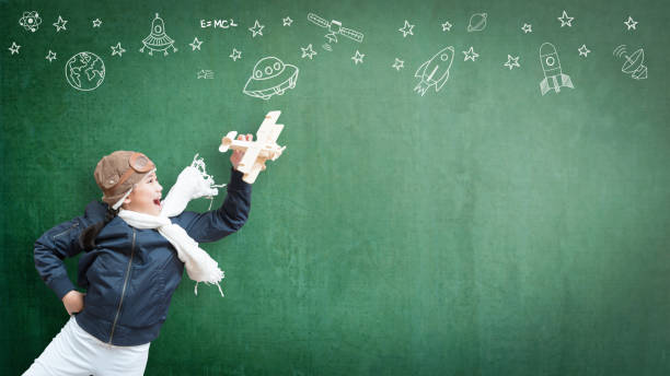 istock Kid in pilot costume and imagination dream in learning inspiration world in innovative science technology engineering maths STEM education and universal children's day concept 1017408200