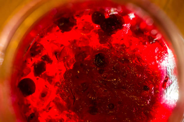 istock Bright translucent red currant jam in a glass jar 1017425602
