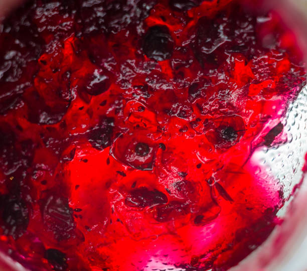 istock Bright translucent red currant jam in a glass jar 1017431084