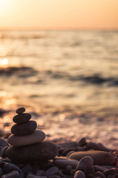 istock stack of zen stones on pebble beach 1017431094
