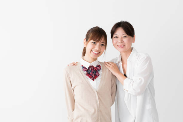 istock young asian mother and daughter on white background 1017437856