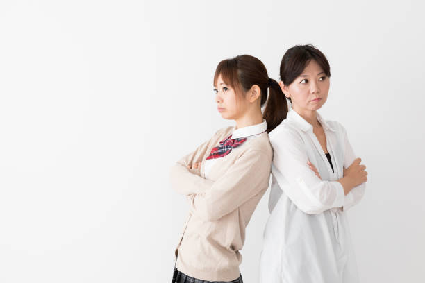 istock young asian mother and daughter on white background 1017437864