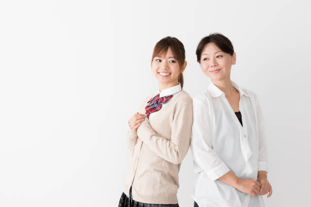 istock young asian mother and daughter on white background 1017437874