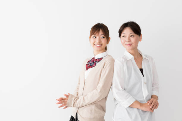 istock young asian mother and daughter on white background 1017437878
