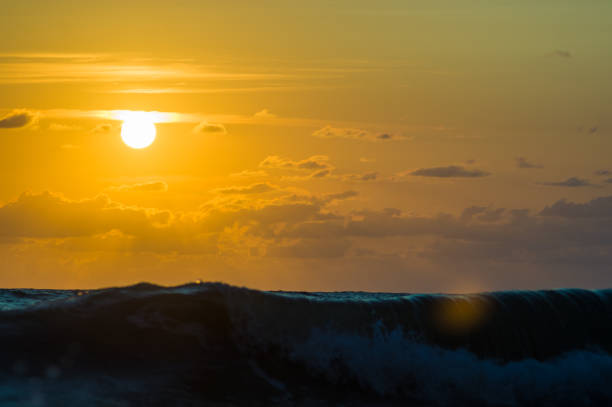 istock Amazing sea sunset on the pebble beach, the sun, waves, clouds 1017448614