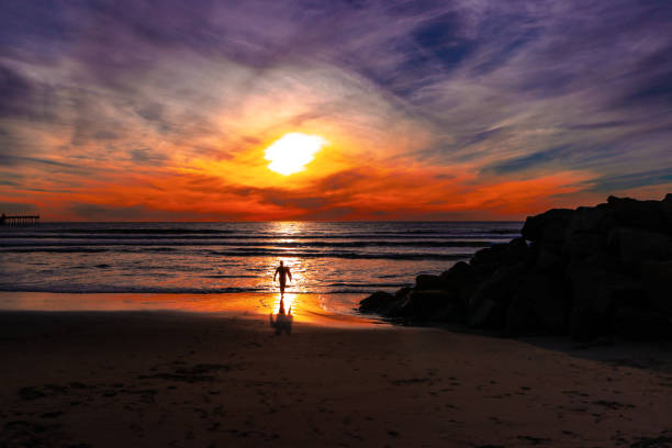 istock Surfing Off Into The Sunset 1017453324