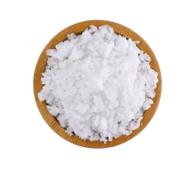 istock salt in a wooden bowl isolated on white background 1017471334
