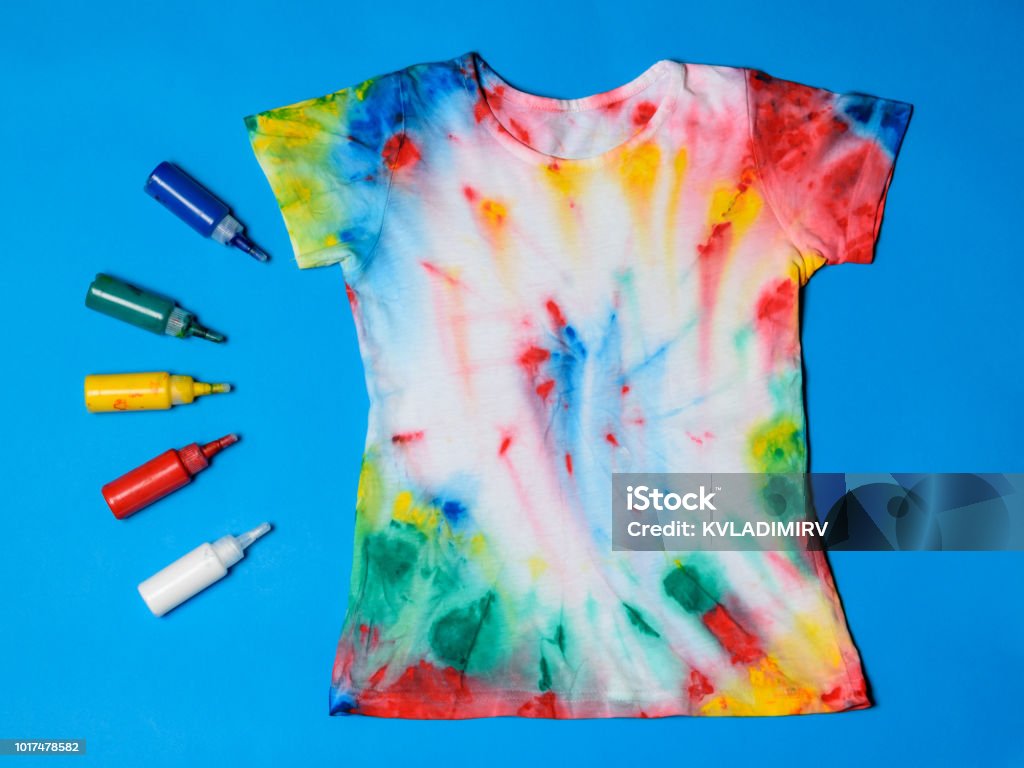 Tubes Of Paint For Clothes And Tshirt In Tie Dye Style On A Blue Table Flat  Lay Stock Photo - Download Image Now - iStock