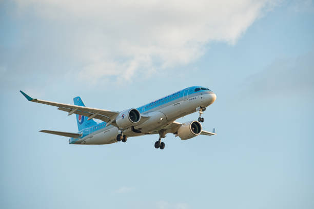 Gimpo, Korea - August 11, 2018: Korean Air Airbus A220-300 landing on Gimpo International Airport in South Korea.