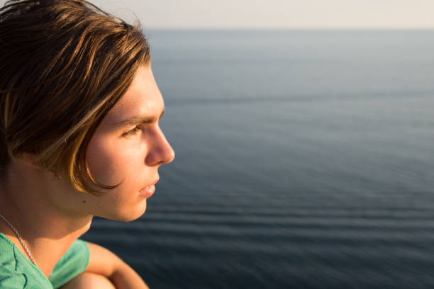 istock A young guy is resting on the sea. 1017515138