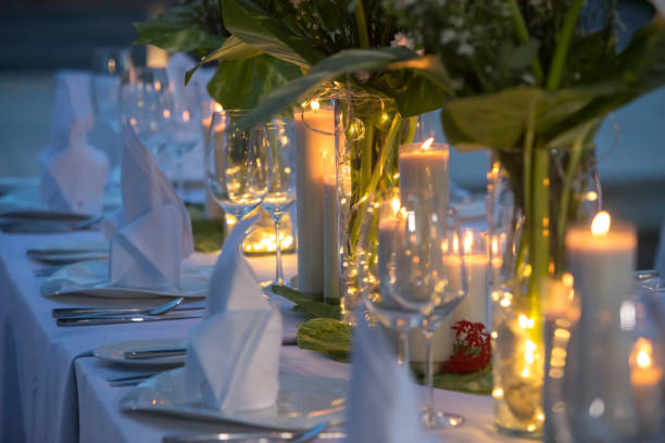 istock Wedding Banquet or gala dinner decorated with garlands. Festive table set up decor for wedding, party or event 1017517470
