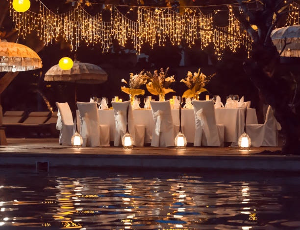 istock Wedding Banquet or gala dinner decorated with garlands. Festive table set up decor for wedding, party or event 1017523878