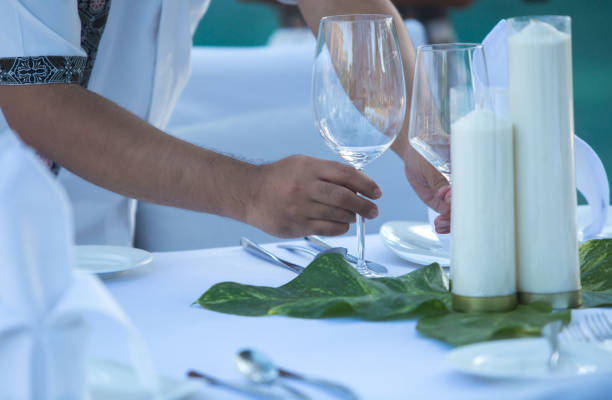 istock Waiter Setting Table At Restaurant for Wedding, Party or Event 1017523936