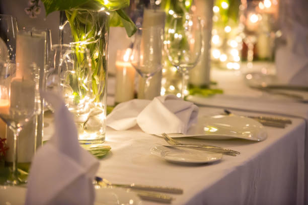 istock Wedding Banquet or gala dinner decorated with garlands. Festive table set up decor for wedding, party or event 1017526412