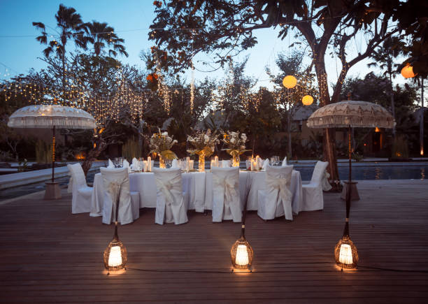 istock Wedding Banquet or gala dinner decorated with garlands. Festive table set up decor for wedding, party or event 1017526506