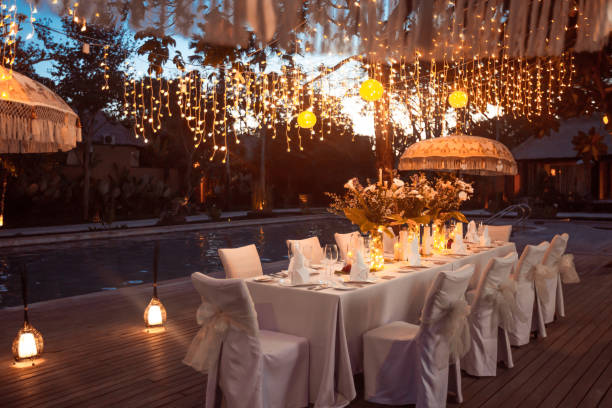 istock Wedding Banquet or gala dinner decorated with garlands. Festive table set up decor for wedding, party or event 1017526592