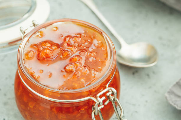 istock Glass jar with cloudberry jam. Nordic cuisine. 1017553682