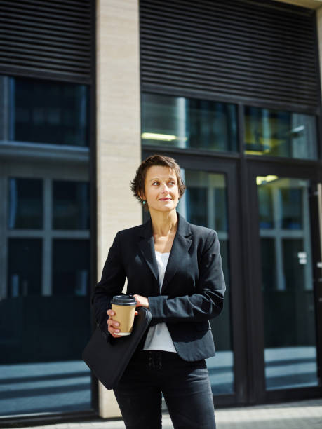 istock Professional elegant businesswoman with coffee cup 1017557000