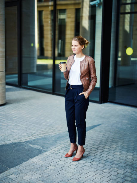 istock Stylish modern businesswoman with coffee 1017557088