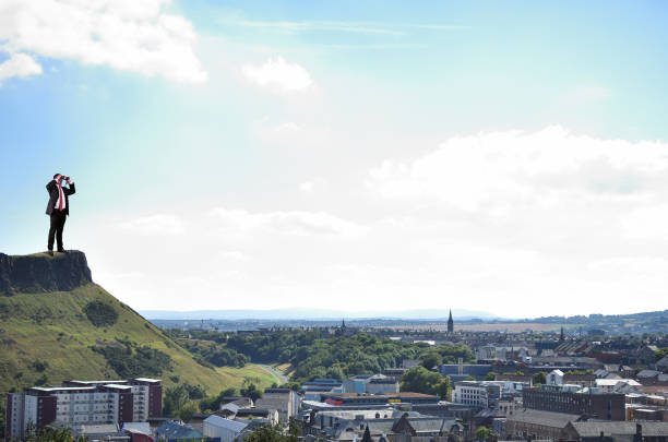 Taken for the entrance to Edinburgh Castle in Edinburgh Scotland, off in the distance is famous Arthur's Seat on the outskirts of town.  This is a favorite site for tourists who come to visit Edinburgh.