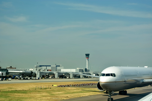 Close-up of large passenger aircraft on runway in airport.