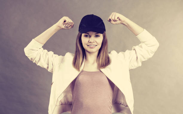 istock Young woman showing her arm muscles 1017566728