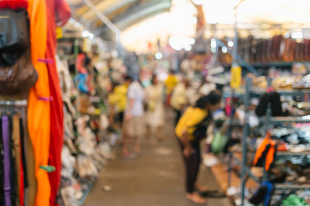 istock Abstract blurred people shopping at second hand market for background 1017577950