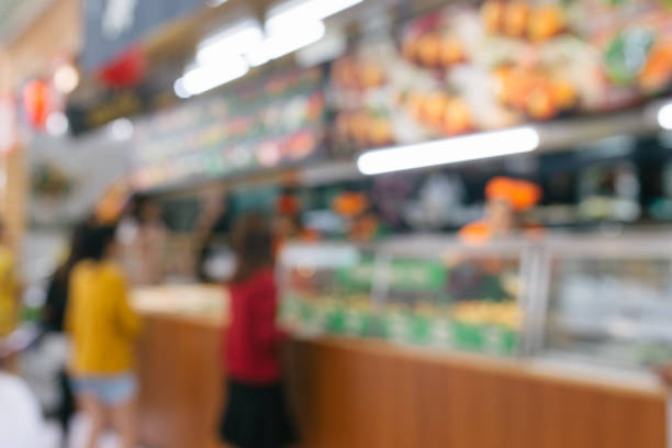 istock Abstract blurred people queuing in front of sushi bar for background 1017580158