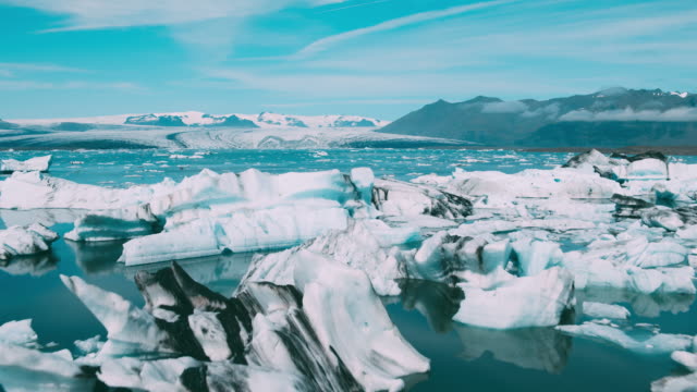 Aerial view of beautiful blue glacier lagoon with giant icebergs in Iceland