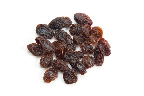 istock Topview of raisins isolated on white background 1017588456