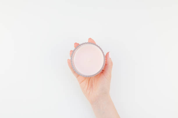 istock Woman hand with pink candle 1017594018