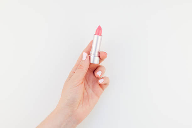 istock Woman hand with pink lipstick 1017594118