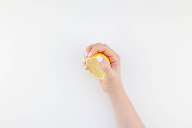 istock Woman hand with lemon 1017594240