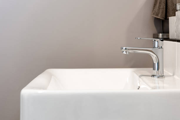 istock Bathroom interior with sink and faucet 1017602004