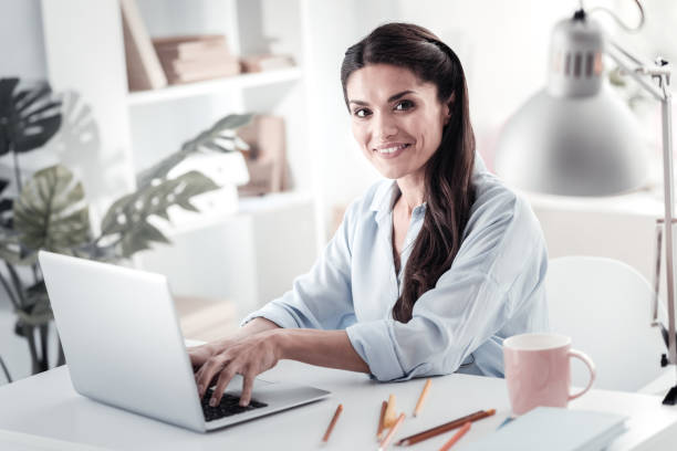 istock Portrait of delighted female that looking at camera 1017608162