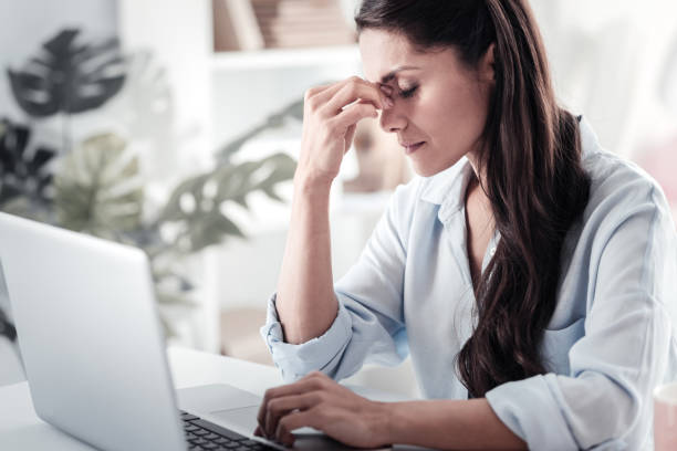 istock Thoughtful brunette female trying to concentrate 1017608180