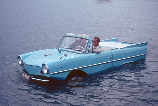 Berlin (West), Germany, 1963. An owner of an amphibious vehicle takes a shortcut over the Berlin Wannsee.