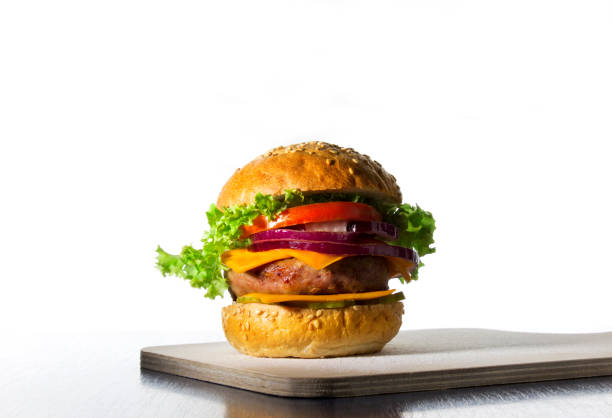 istock hamburger with cheese, onions, cucumbers and a glass with a drink 1017620096