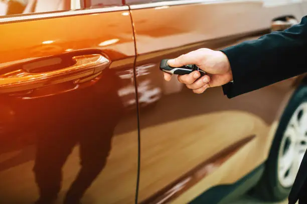 Man hand unlocking car